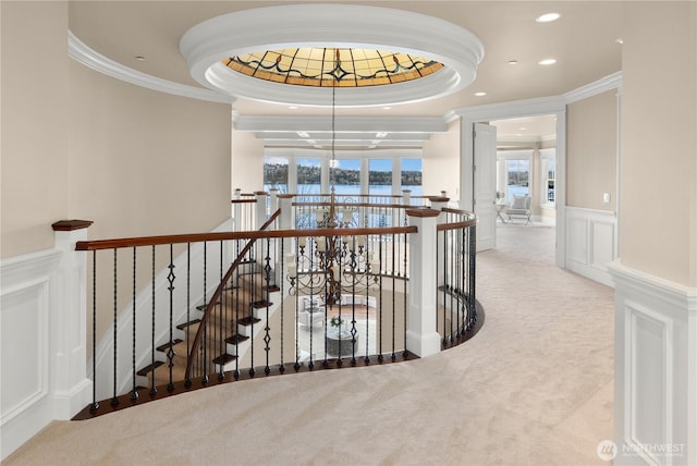 8071 W Mercer Way, Mercer Island, WA 98040 - hall with an upstairs landing, a tray ceiling, ornamental molding, carpet floors, and a water view