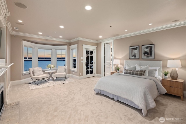 8071 W Mercer Way, Mercer Island, WA 98040 - bedroom with light carpet, ornamental molding, recessed lighting, and a water view