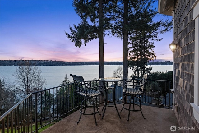 8071 W Mercer Way, Mercer Island, WA 98040 - patio terrace at dusk featuring a water view