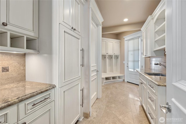 8071 W Mercer Way, Mercer Island, WA 98040 - kitchen with open shelves, decorative backsplash, recessed lighting, and light stone counters