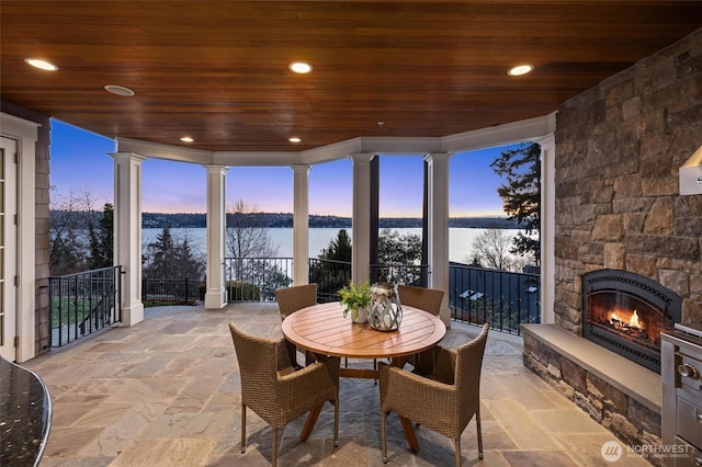 8071 W Mercer Way, Mercer Island, WA 98040 - sunroom with a water view