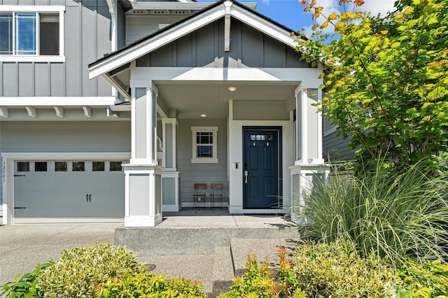 32803 Stuart Ave SE, Black Diamond, WA 98010 - doorway to property featuring board and batten siding, an attached garage, a porch, and asphalt driveway