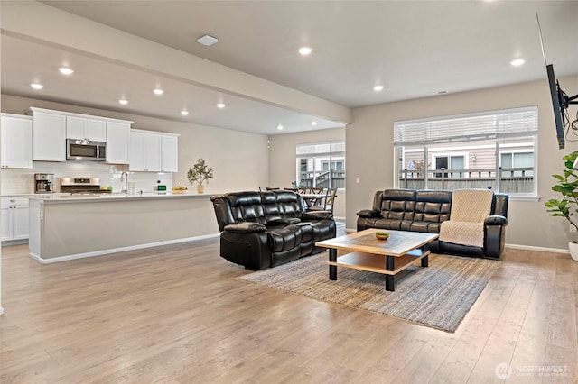 32803 Stuart Ave SE, Black Diamond, WA 98010 - living area featuring light wood-style floors, healthy amount of natural light, and recessed lighting