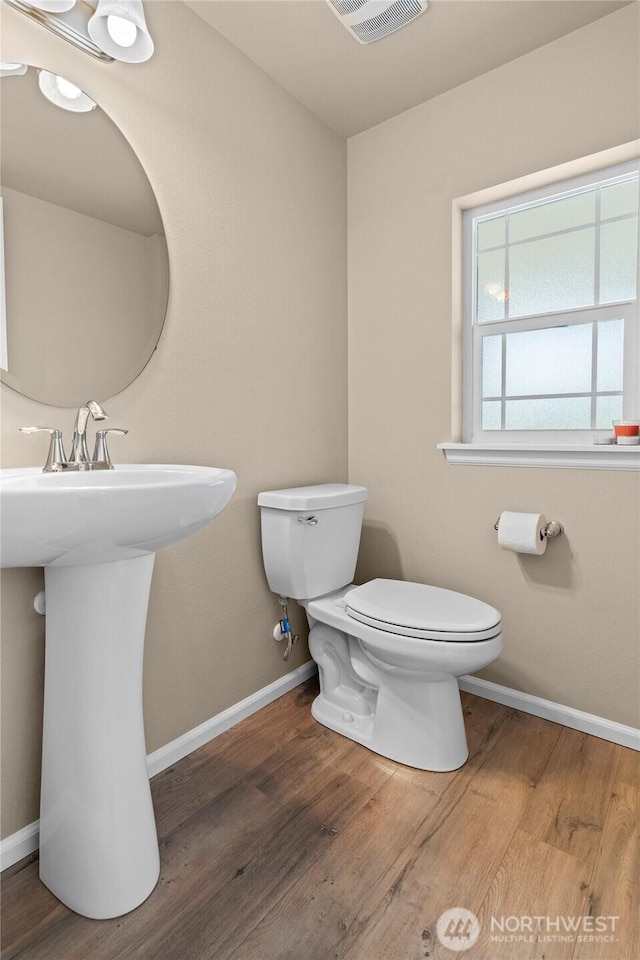 32803 Stuart Ave SE, Black Diamond, WA 98010 - half bathroom with toilet and wood finished floors