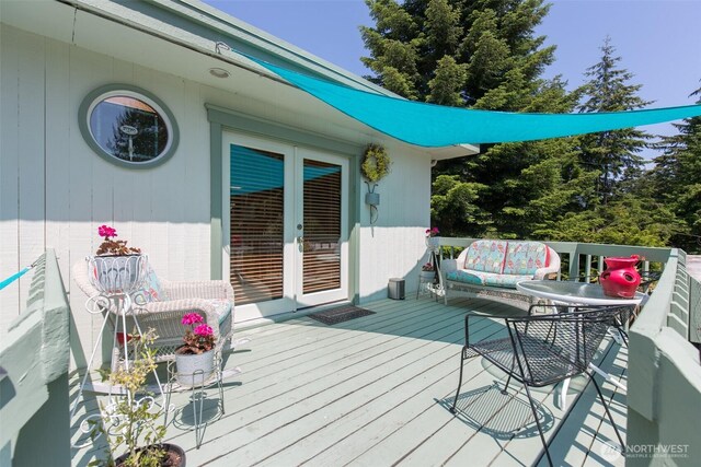215 Amber Ln, Sequim, WA 98382 - wooden terrace with french doors and an outdoor living space