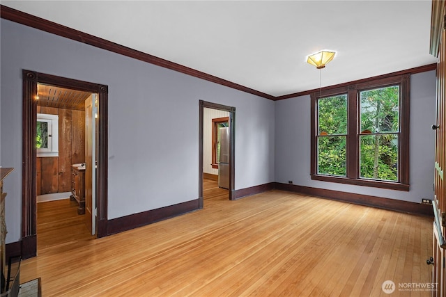 1114 5th Ave SW, Olympia, WA 98502 - unfurnished room featuring light wood-style floors and crown molding