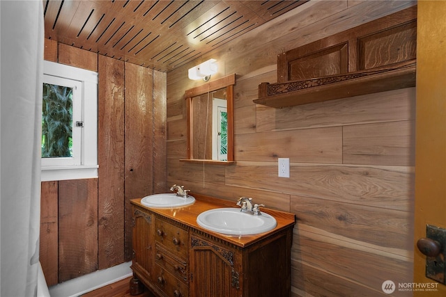 1114 5th Ave SW, Olympia, WA 98502 - bathroom featuring wooden walls, double vanity, and wood finished floors