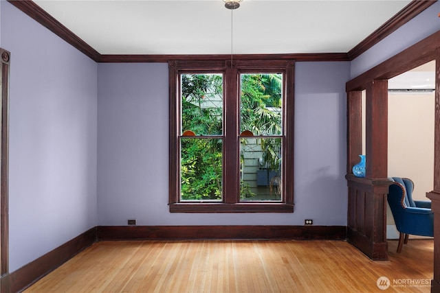 1114 5th Ave SW, Olympia, WA 98502 - unfurnished dining area with crown molding and wood finished floors