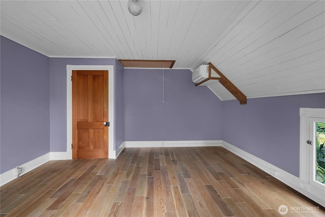 1114 5th Ave SW, Olympia, WA 98502 - bonus room featuring attic access, wood ceiling, wood finished floors, an AC wall unit, and vaulted ceiling
