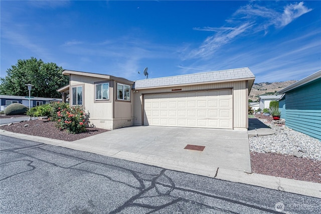 1700 Twin Peaks Dr Unit 71, Wenatchee, WA 98801 - view of front of house with concrete driveway and an attached garage