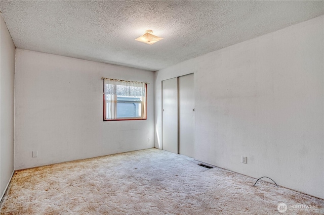 1700 Twin Peaks Dr Unit 71, Wenatchee, WA 98801 - carpeted empty room featuring a textured ceiling