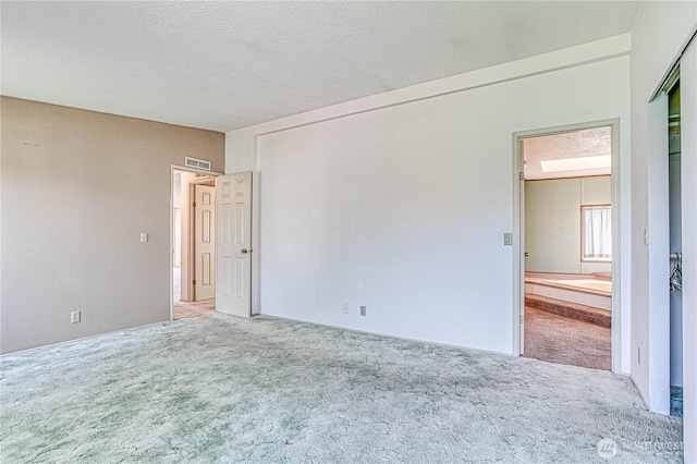 1700 Twin Peaks Dr Unit 71, Wenatchee, WA 98801 - carpeted spare room with a textured ceiling