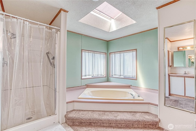 1700 Twin Peaks Dr Unit 71, Wenatchee, WA 98801 - bathroom with ornamental molding, a skylight, a textured ceiling, a bath, and a stall shower