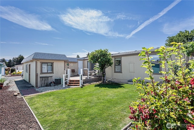 1700 Twin Peaks Dr Unit 71, Wenatchee, WA 98801 - rear view of property with a deck and a yard