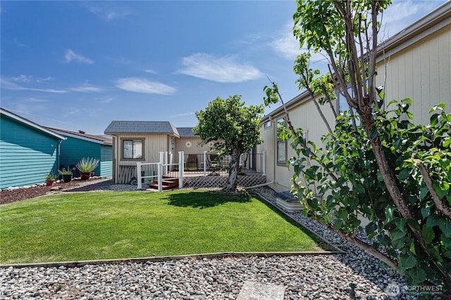 1700 Twin Peaks Dr Unit 71, Wenatchee, WA 98801 - view of green lawn with a deck and an outdoor structure
