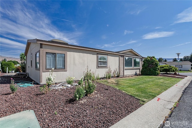 1700 Twin Peaks Dr Unit 71, Wenatchee, WA 98801 - view of front facade with a front lawn