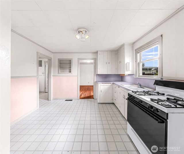 741 Southern Ave, Sedro Woolley, WA 98284 - kitchen with white range with gas stovetop, white cabinetry, and light countertops