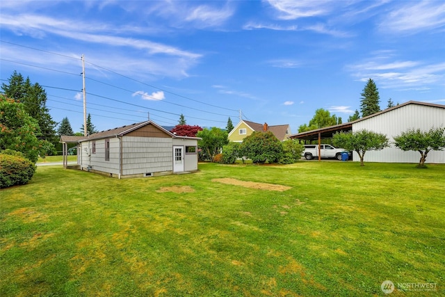 741 Southern Ave, Sedro Woolley, WA 98284 - view of grassy yard featuring an outdoor structure and a carport
