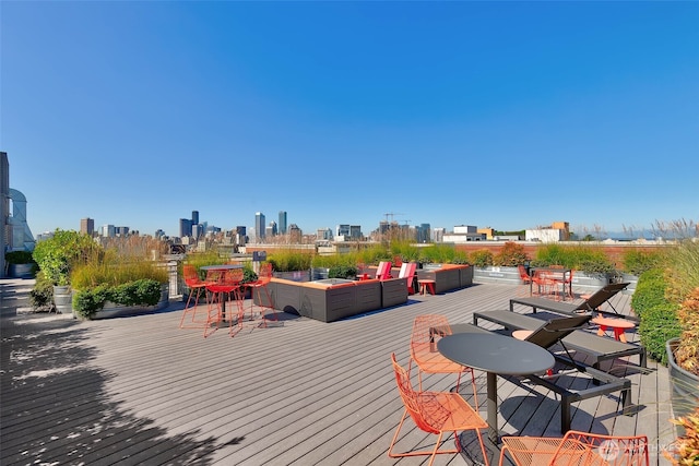 530 Broadway E Unit 612, Seattle, WA 98102 - wooden deck with an outdoor living space and a skyline view