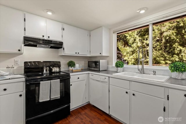 17019 426th Ave SE, North Bend, WA 98045 - kitchen featuring under cabinet range hood, electric range, white dishwasher, stainless steel microwave, and dark wood-style flooring