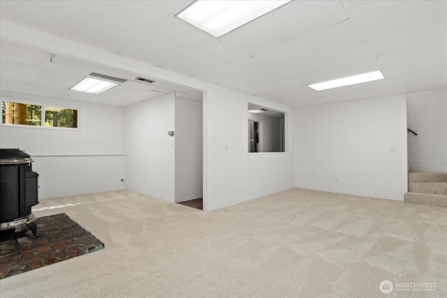 17019 426th Ave SE, North Bend, WA 98045 - unfurnished office with carpet floors and a wood stove
