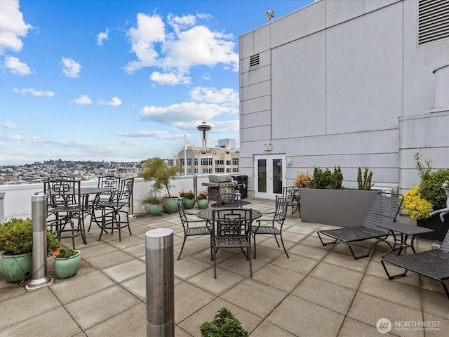 121 Vine St Unit 601, Seattle, WA 98121 - view of patio / terrace with outdoor dining space, french doors, and grilling area