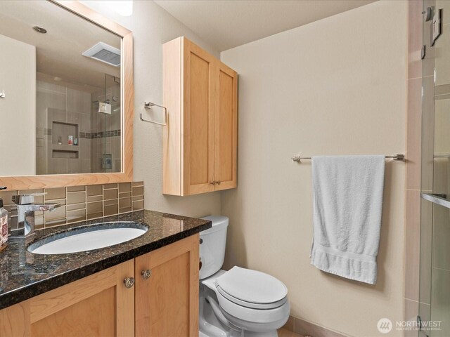 121 Vine St Unit 601, Seattle, WA 98121 - full bath featuring vanity, a stall shower, and tasteful backsplash