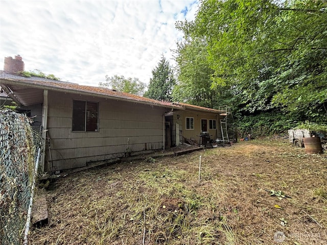 13409 40th Ave S, Tukwila, WA 98168 - back of house featuring a chimney
