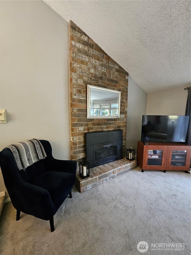 10924 SE 183rd Ct, Renton, WA 98055 - carpeted living area with a textured ceiling, lofted ceiling, and a fireplace