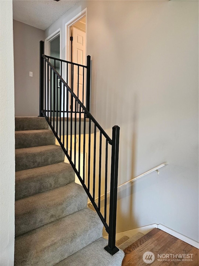 10924 SE 183rd Ct, Renton, WA 98055 - staircase with a textured ceiling