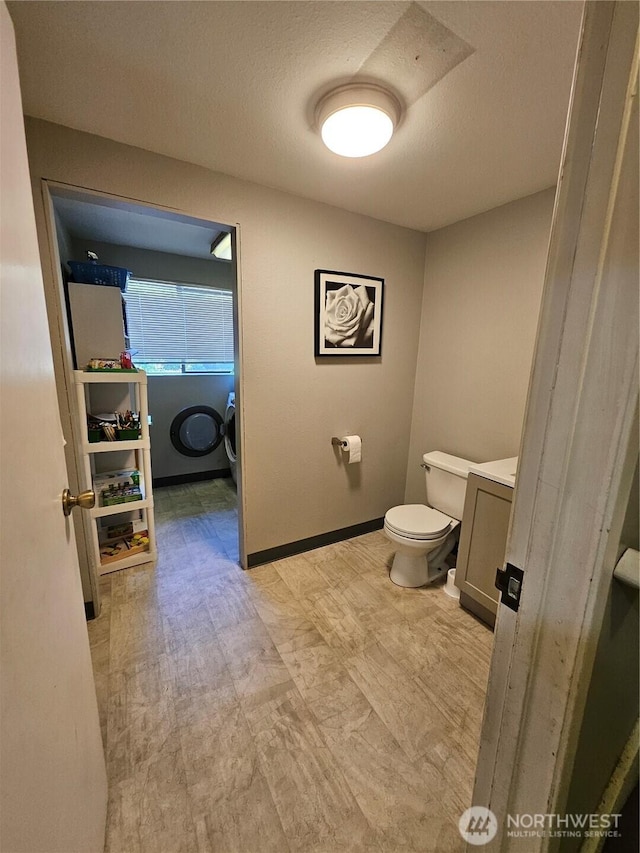 10924 SE 183rd Ct, Renton, WA 98055 - bathroom featuring vanity, washer / clothes dryer, and a textured ceiling