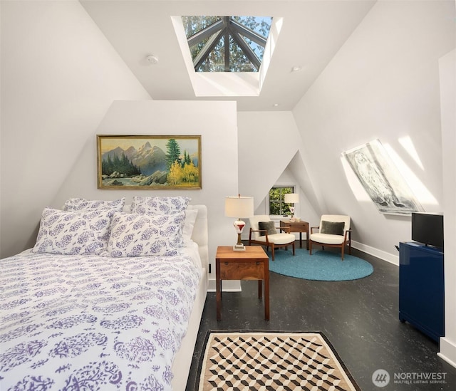 bedroom with vaulted ceiling and a skylight
