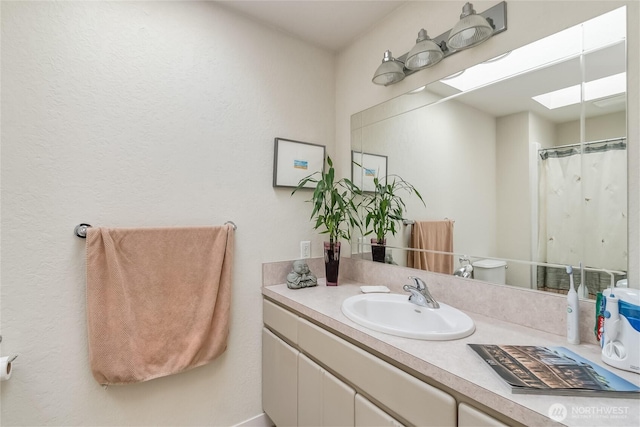 2217 W Birch, Bellingham, WA 98229 - bathroom featuring a skylight and vanity