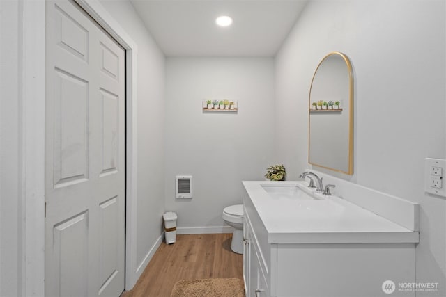 755 S Chelan Ave, Wenatchee, WA 98801 - bathroom with vanity, wood finished floors, heating unit, and recessed lighting