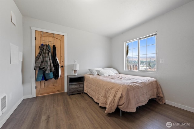 755 S Chelan Ave, Wenatchee, WA 98801 - bedroom with dark wood-style floors and baseboards