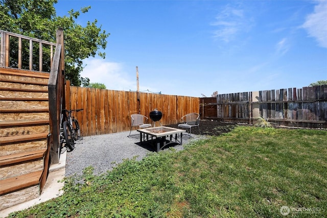 755 S Chelan Ave, Wenatchee, WA 98801 - fenced backyard with a fire pit