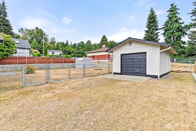 15633 47th Ave S, Tukwila, WA 98188 - fenced yard with an outbuilding, a gate, and a detached garage