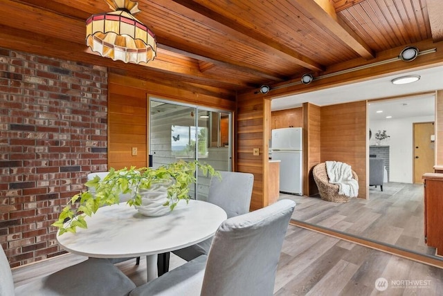 15633 47th Ave S, Tukwila, WA 98188 - dining space featuring a wood ceiling with exposed beams, wood walls, and light wood-style floors