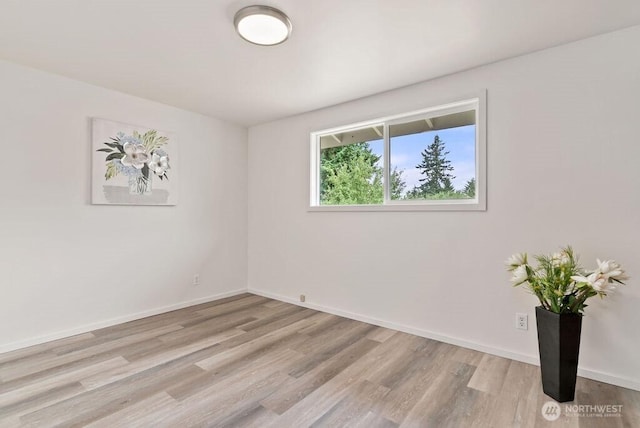 15633 47th Ave S, Tukwila, WA 98188 - empty room featuring wood finished floors and baseboards