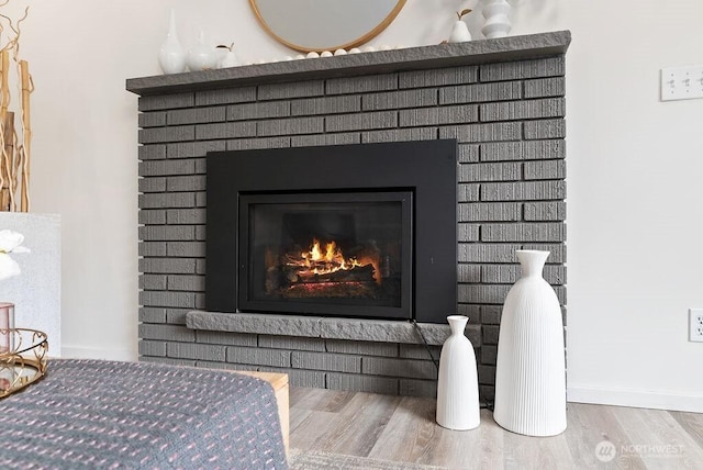 15633 47th Ave S, Tukwila, WA 98188 - detailed view of wood finished floors and a fireplace