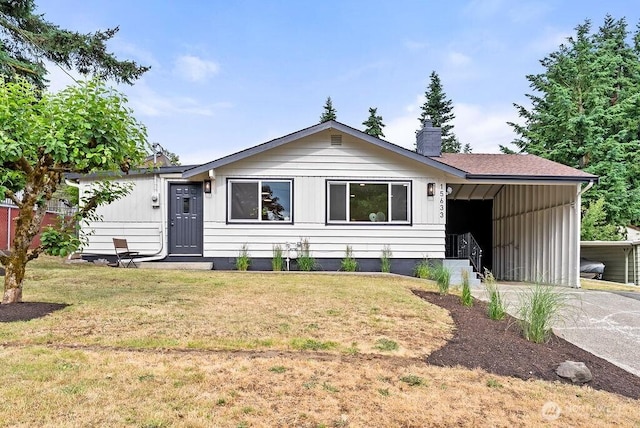 15633 47th Ave S, Tukwila, WA 98188 - ranch-style house featuring a front yard, a chimney, driveway, an attached carport, and board and batten siding