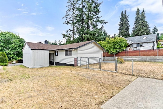 15633 47th Ave S, Tukwila, WA 98188 - rear view of house with a gate and a chimney
