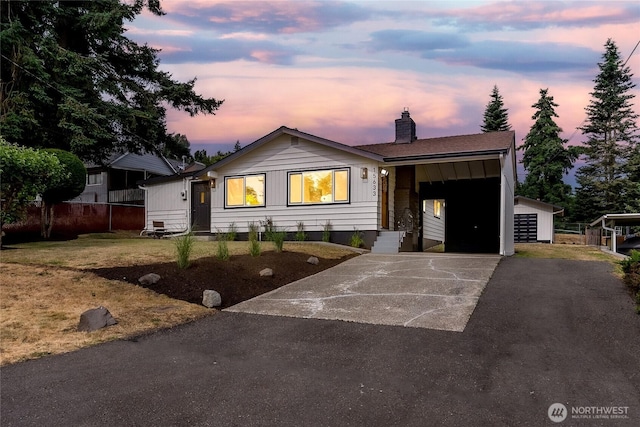 15633 47th Ave S, Tukwila, WA 98188 - ranch-style home featuring a chimney and asphalt driveway