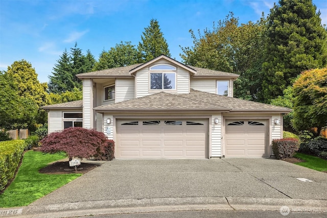 11926 SE 198th Ct, Kent, WA 98031 - traditional home with driveway, a garage, and a shingled roof