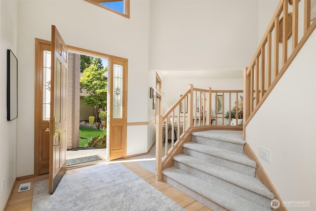 11926 SE 198th Ct, Kent, WA 98031 - entryway with stairs, wood finished floors, and a high ceiling