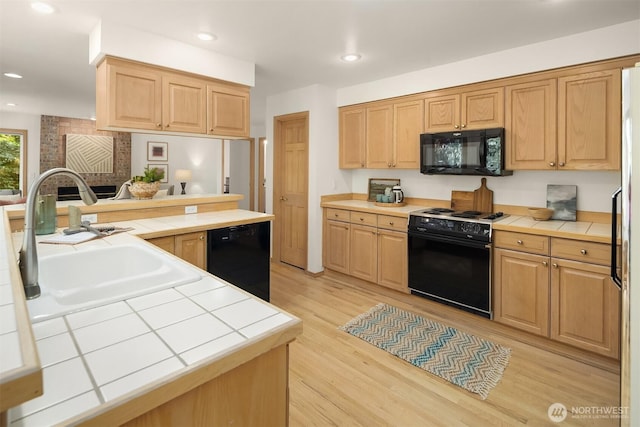 11926 SE 198th Ct, Kent, WA 98031 - kitchen featuring black appliances, tile countertops, light wood-type flooring, and recessed lighting