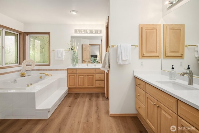 11926 SE 198th Ct, Kent, WA 98031 - bathroom with wood finished floors, two vanities, and a garden tub