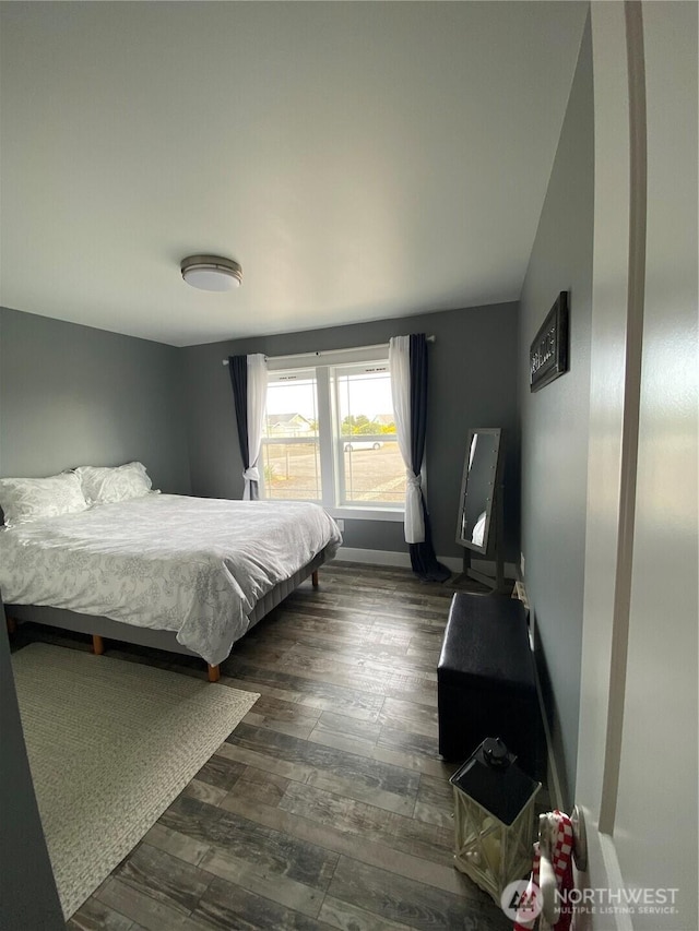 1111 Riverside Ct, Ocean Shores, WA 98569 - bedroom with dark wood-style flooring and baseboards
