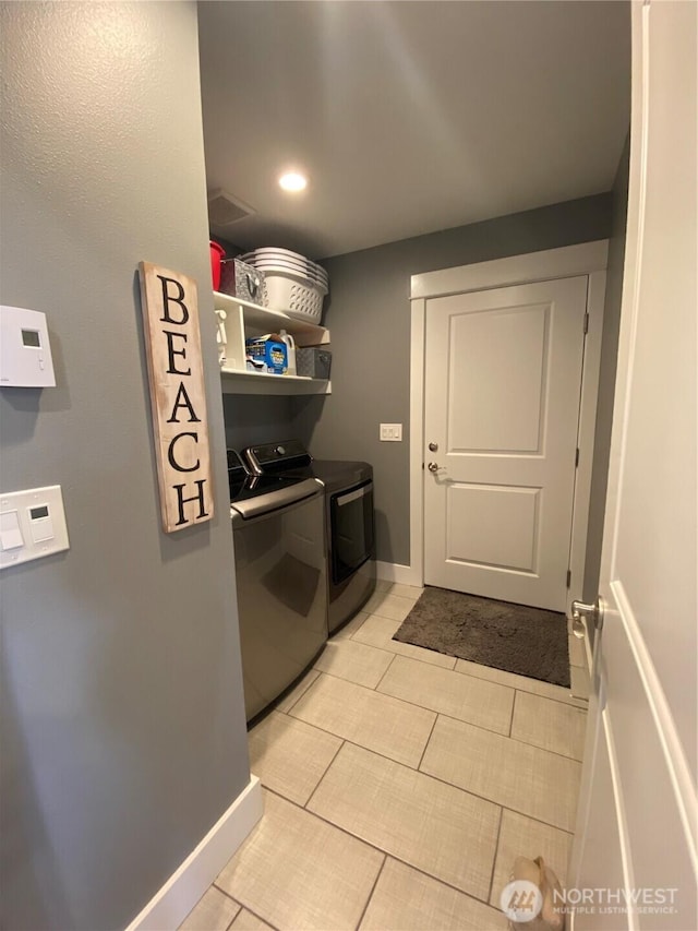 1111 Riverside Ct, Ocean Shores, WA 98569 - laundry area with washer and clothes dryer and light tile patterned floors