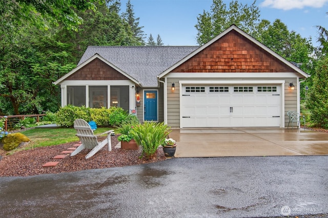 721 Abernathy Creek Rd, Longview, WA 98632 - view of front of property with driveway, roof with shingles, a sunroom, and a garage